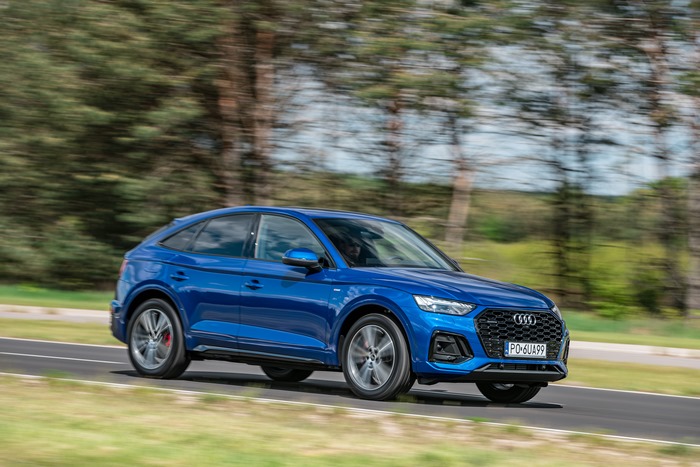 Blue Audi Q5 Sportback SUV driving on road