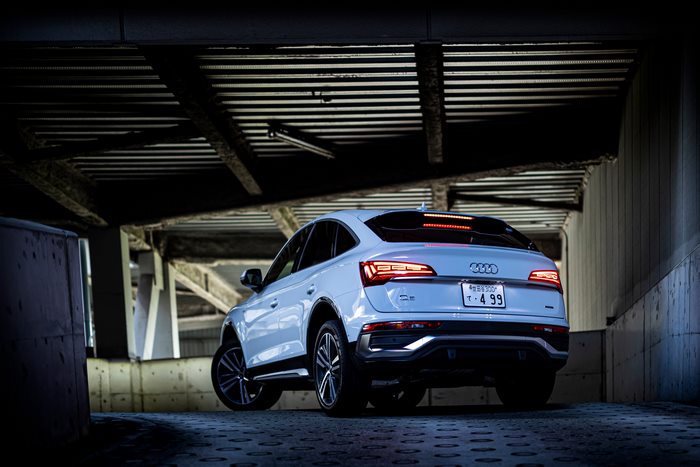 White Audi Q5 Sportback under concrete overpass