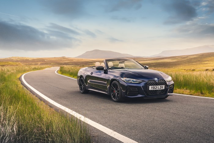 BMW M440i xDrive Cabriolet on a beautiful country road