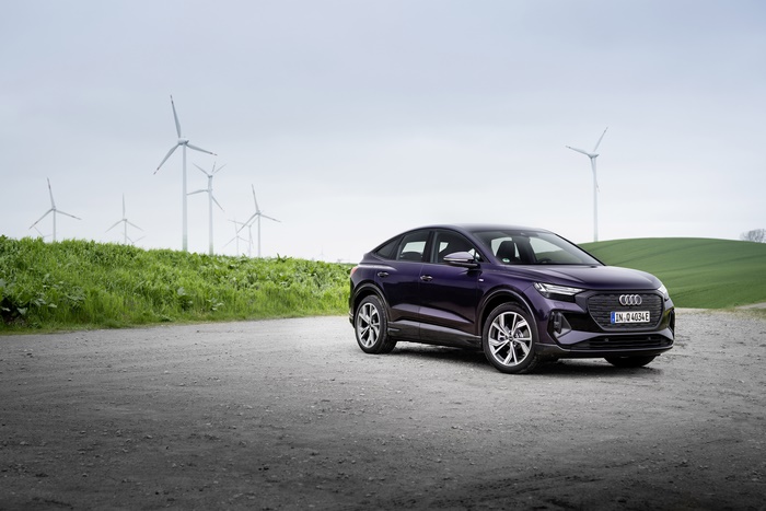 Purple Audi Q4 Sportback e-tron electric SUV by wind farm