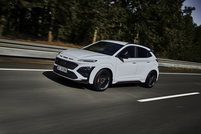 White Hyundai Kona N SUV driving on a road