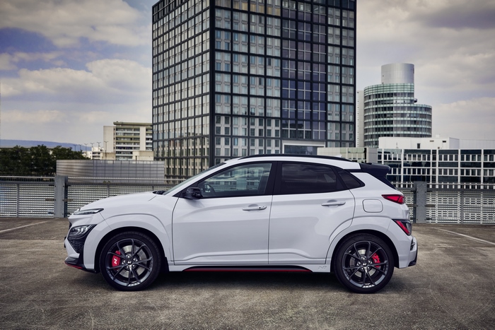 White Hyundai Kona N SUV on city rooftop