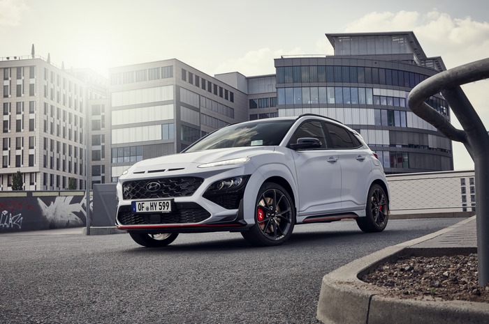 White Hyundai Kona N SUV in a modern urban setting