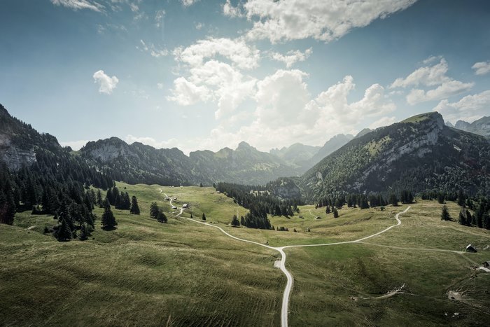 Winding Road through Green Mountain Landscape