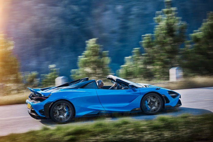 Blue McLaren 765LT Spider driving on road