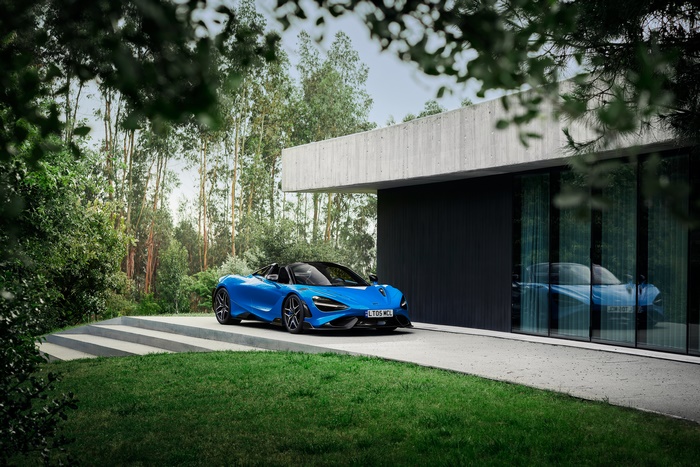 Blue McLaren 765LT Spider parked at a modern house