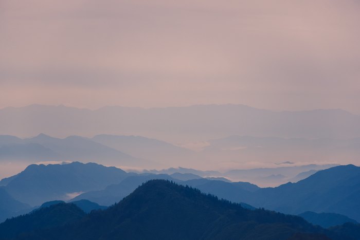 Layered Blue Mountains and Pink Sky
