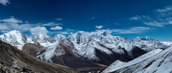 Majestic Snow-Capped Mountains Under Blue Sky