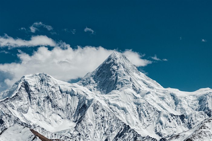 Majestic snowy mountain with clouds