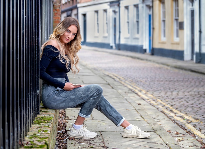 Blonde Model Sitting on Sidewalk in 4K