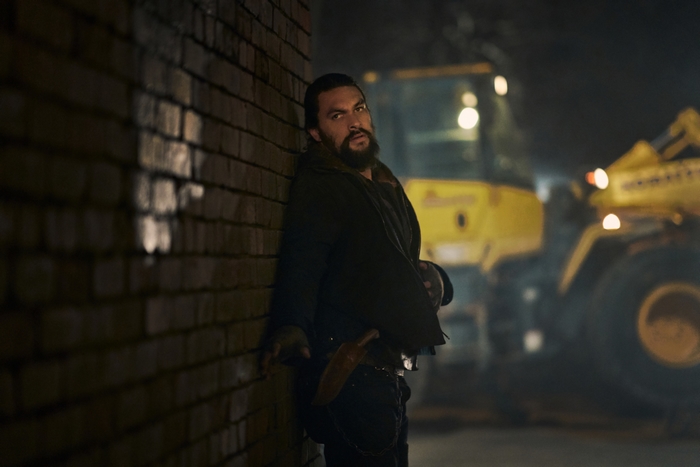 Jason Momoa in Sweet Girl leaning against a wall