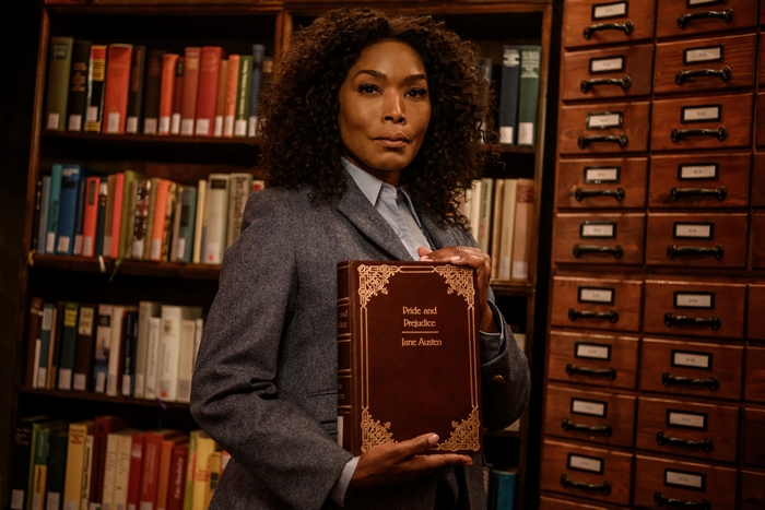 Angela Bassett holding Pride and Prejudice book, Gunpowder Milkshake