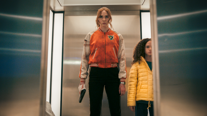 Gunpowder Milkshake: Karen Gillan holding gun with Chloe Coleman