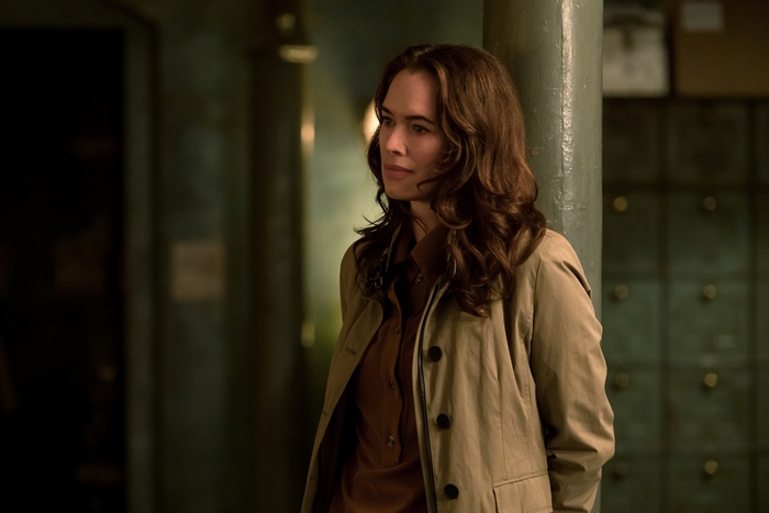 Lena Headey in Gunpowder Milkshake wearing a trench coat