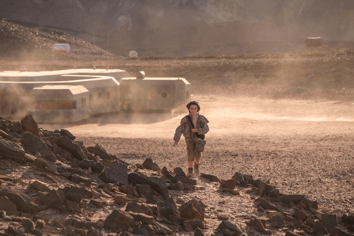 Brooklynn Prince walks through dusty settlement in Settlers HD