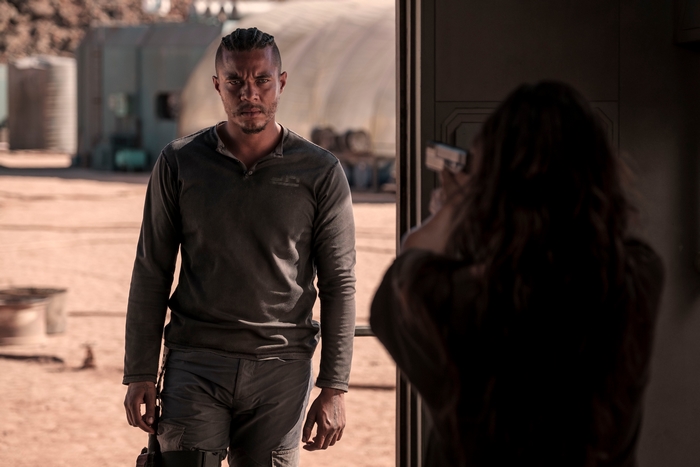Ismael Cruz Córdova faces a gun in Settlers