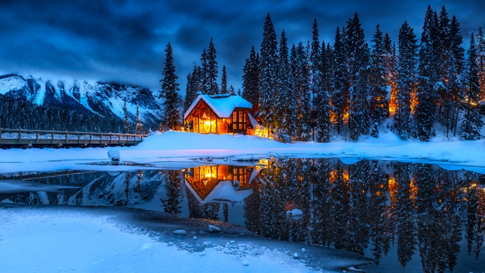 Cozy Winter Cabin by Snowy Lake Reflection