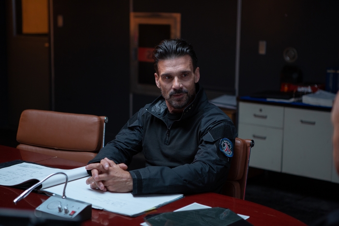 Frank Grillo in Cosmic Sin sitting at a table