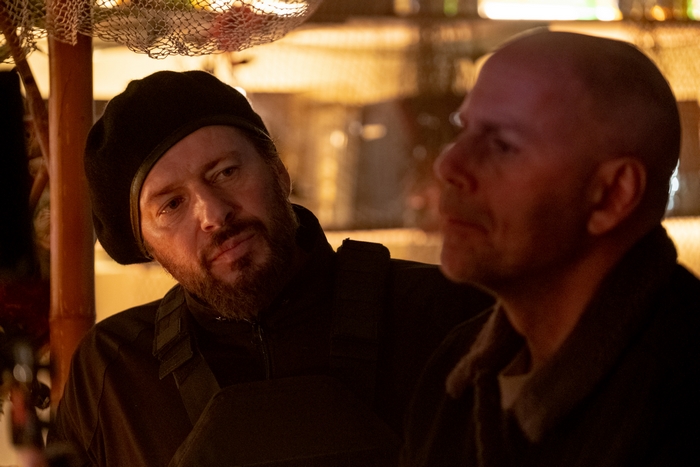 Bearded man watches Bruce Willis in Cosmic Sin