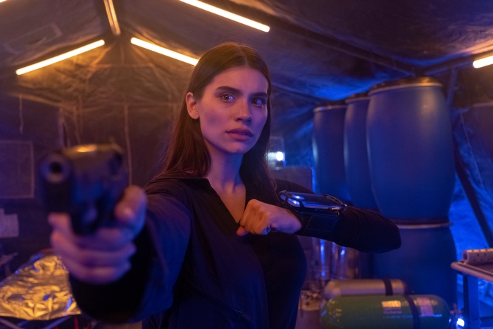 Eva de Dominici aiming gun in Cosmic Sin