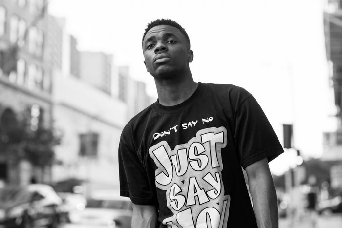 Vince Staples in black and white urban portrait