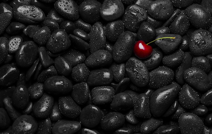 Red Cherry on Wet Black Stones