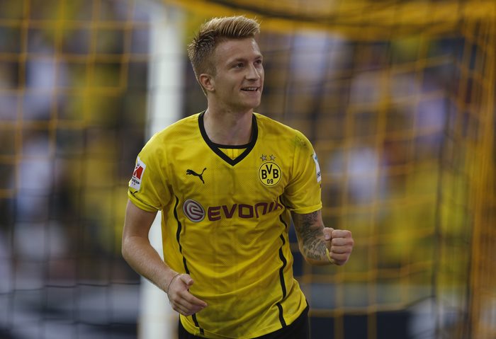 Marco Reus smiles in Borussia Dortmund football kit
