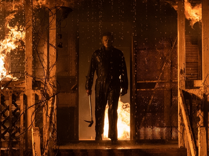Michael Myers emerges from burning house in rain