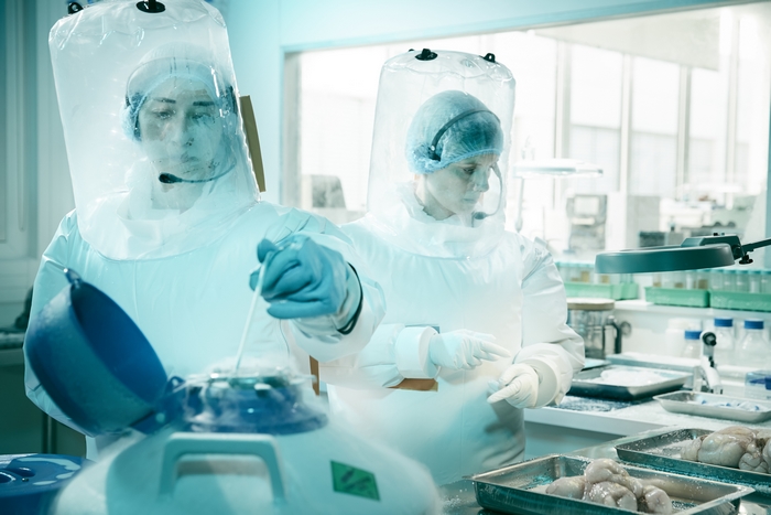 Melanie Laurent in hazmat suit in Oxygen movie lab