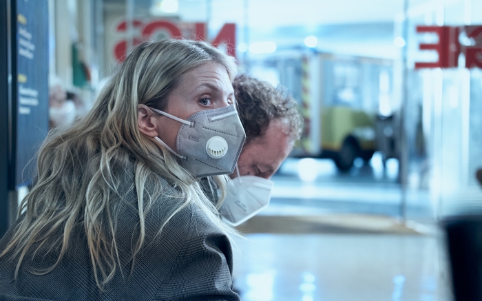 Melanie Laurent wearing KN95 mask indoors