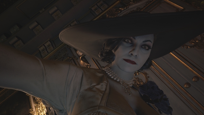 Alcina Dimitrescu looking down with a piercing stare