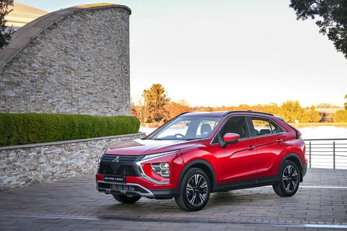 Red Mitsubishi Eclipse Cross SUV by the water