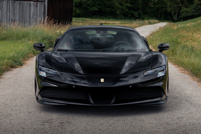 Black Novitec Ferrari SF90 Stradale Supercar on road