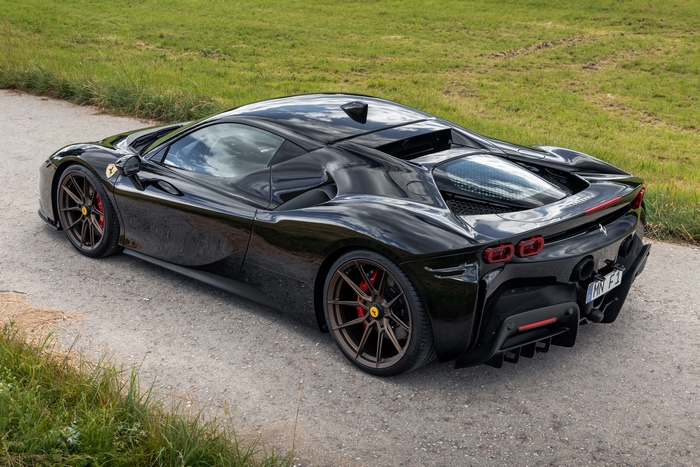 Black Novitec Ferrari SF90 Stradale Supercar parked outdoors