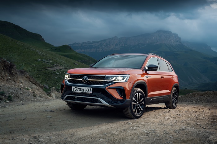 Orange 2021 Volkswagen Taos SUV in mountains