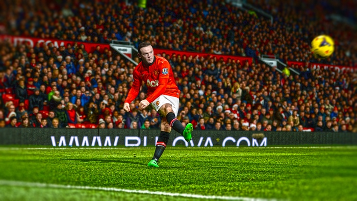 Wayne Rooney kicks the ball for Manchester United