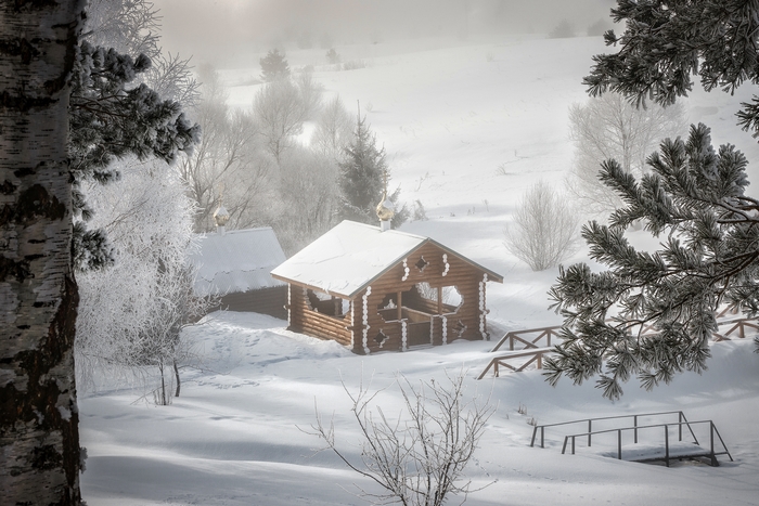 Snowy Winter Cabin with Golden Domes