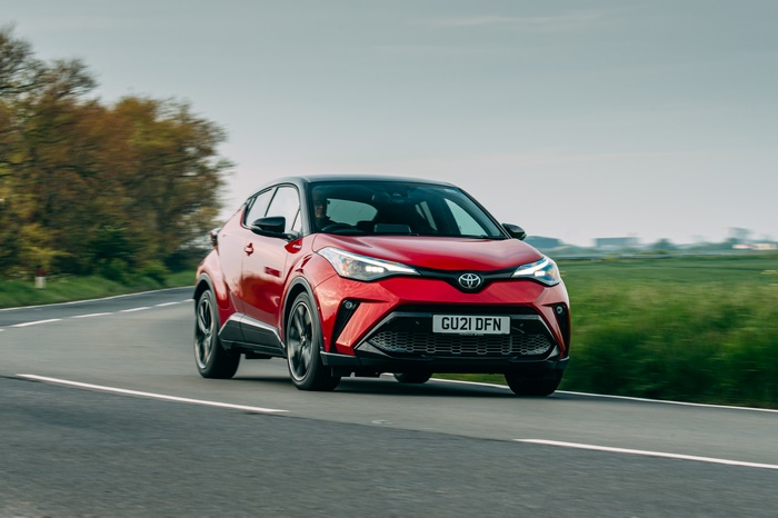 Red Toyota C-HR Hybrid GR Sport SUV on road