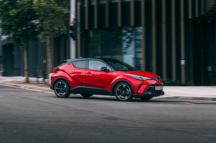 Red Toyota C-HR Hybrid GR Sport SUV driving