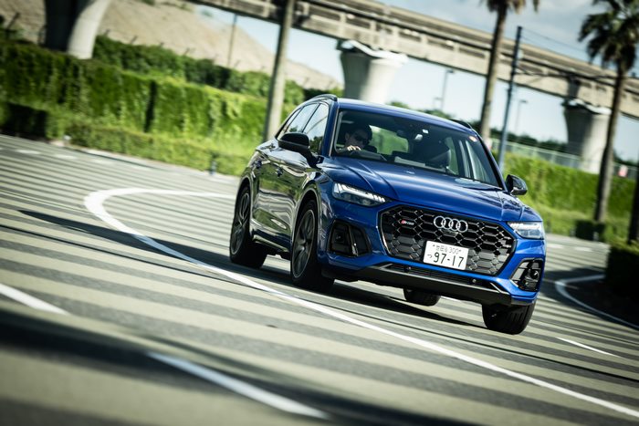 Blue Audi SQ5 SUV driving on a road