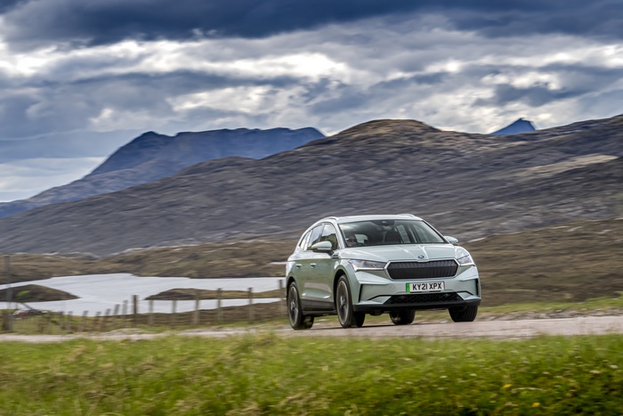 Electric Škoda Enyaq IV 80 SUV driving through mountains