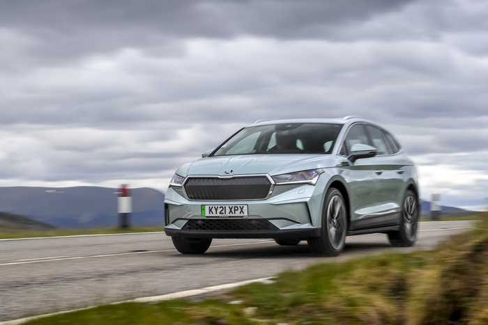 Škoda Enyaq IV 80 electric SUV driving through mountains
