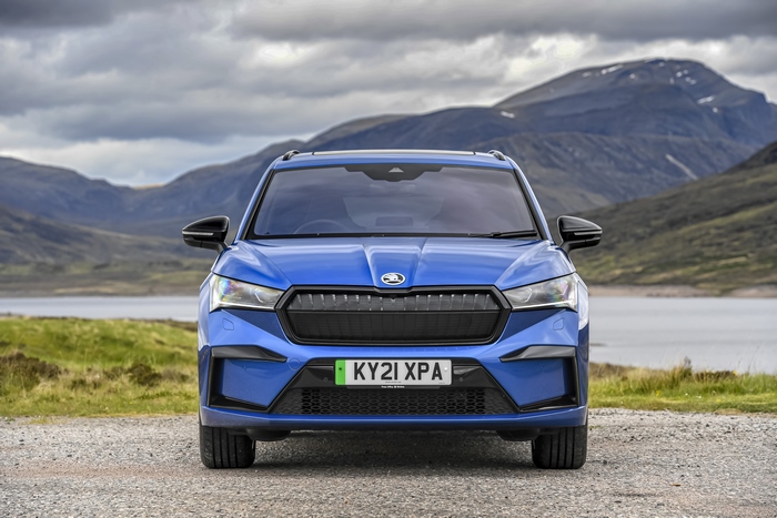 Blue Škoda Enyaq Sportline iV 80 SUV in scenic landscape