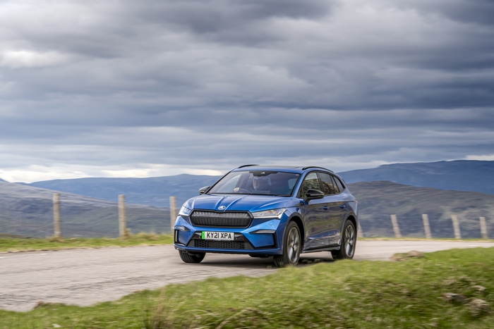 Blue Škoda Enyaq electric SUV on a cloudy mountain road