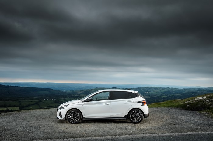 White Hyundai i20 N Line parked on a scenic overlook