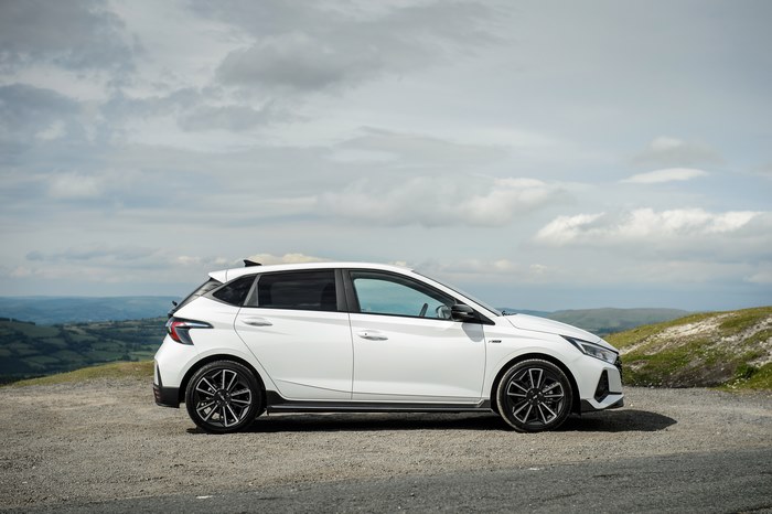 White Hyundai i20 N Line parked on a scenic road