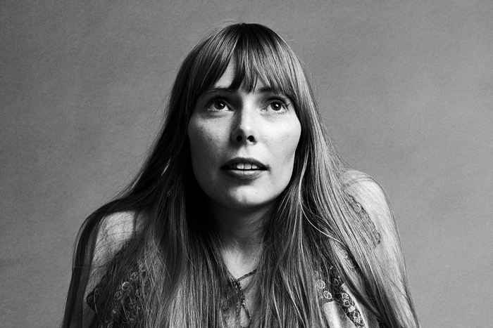Joni Mitchell looking up in black and white portrait