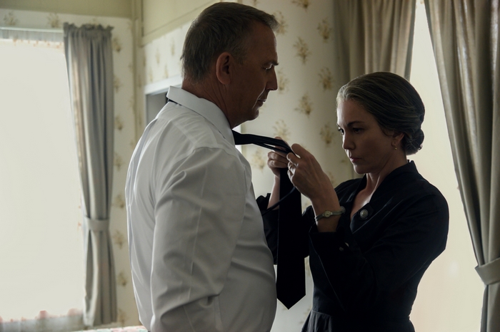 Diane Lane tying Kevin Costner's tie in Let Him Go