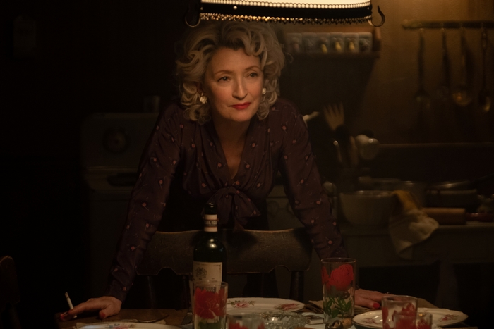 Lesley Manville in Let Him Go leaning on table