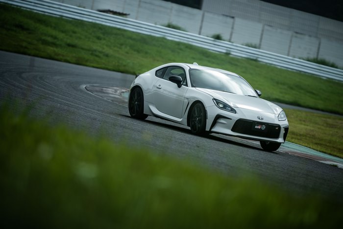 White Toyota GR 86 Sport Car Cornering on Track